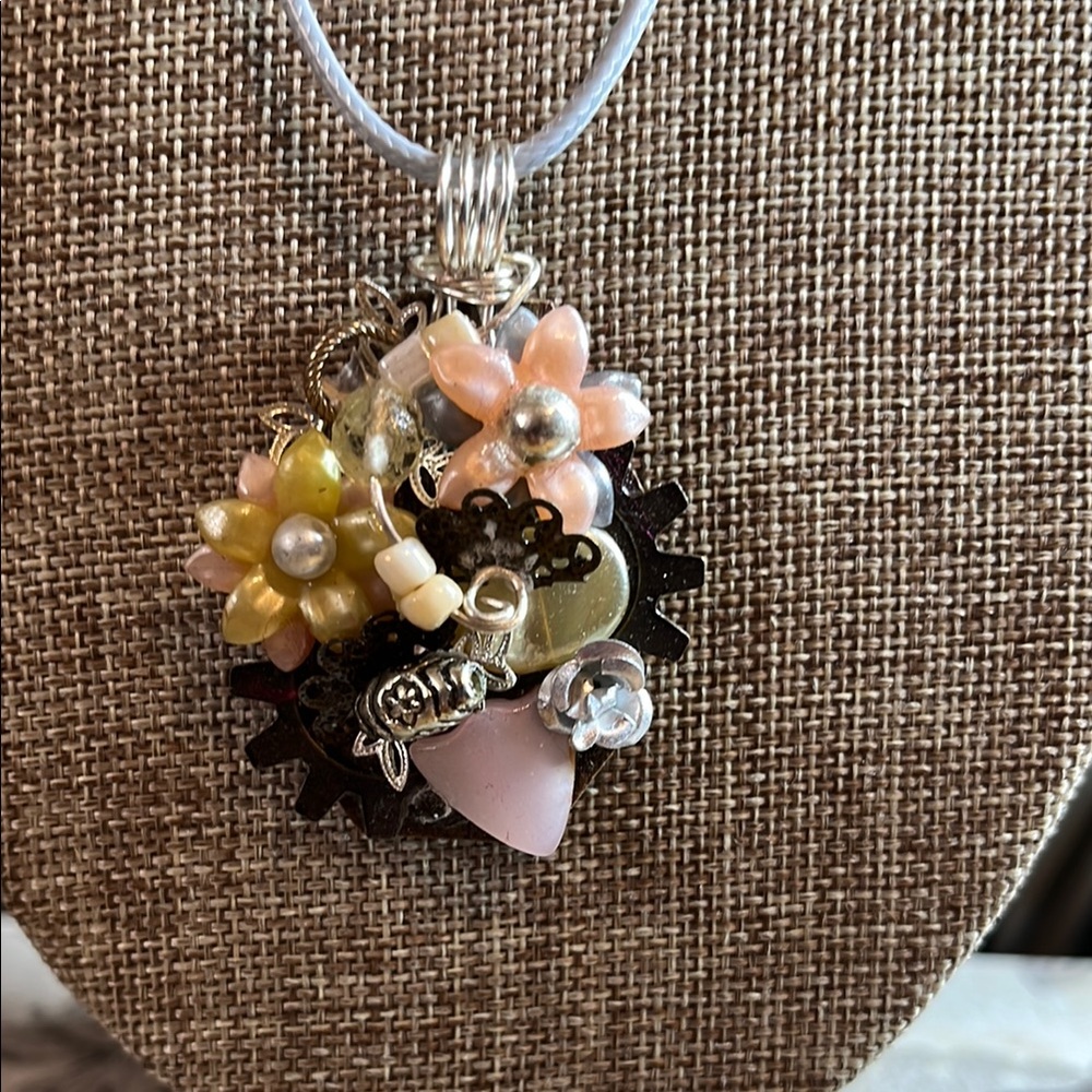 Up cycled one of a kind Floral Charm Pendant on grey rope chain